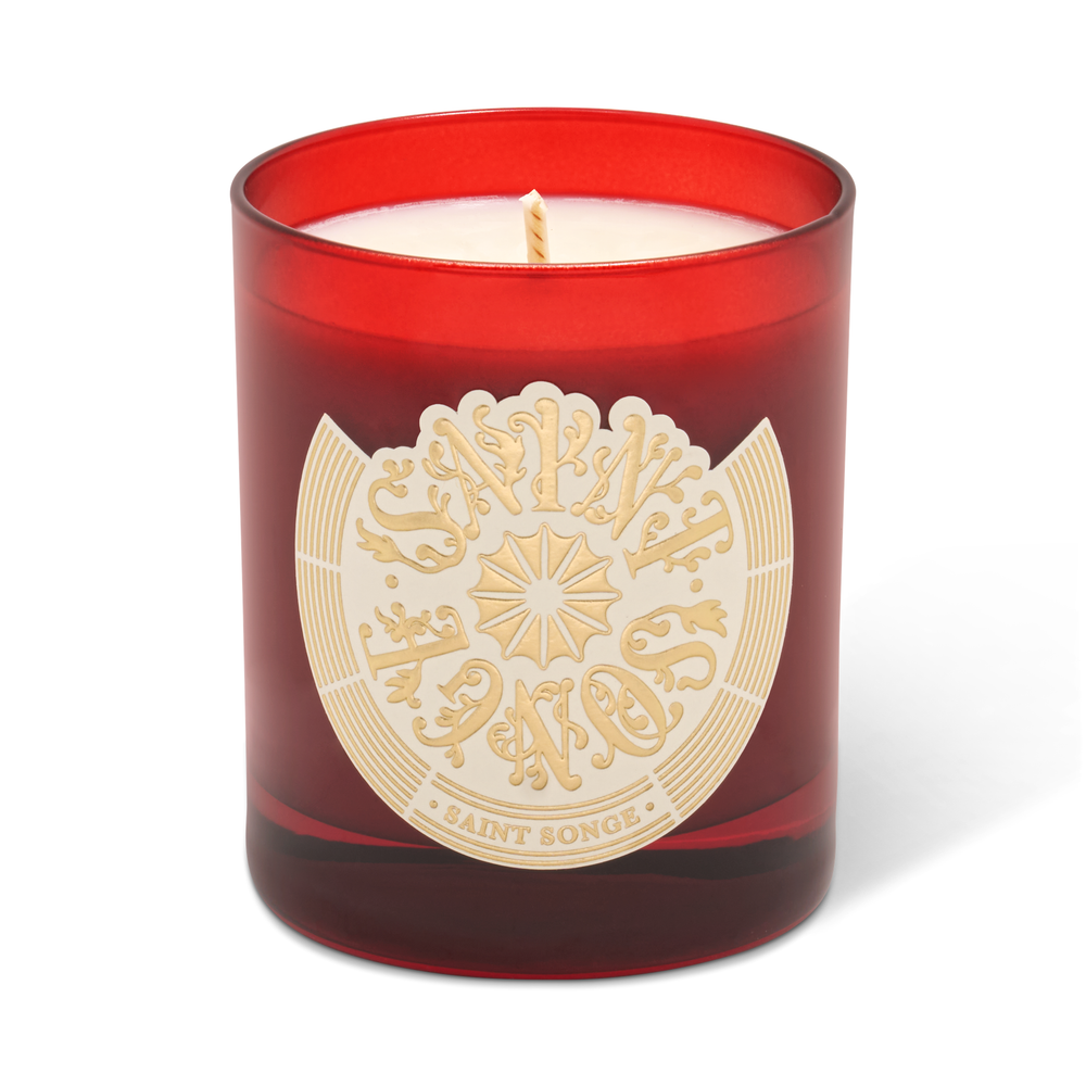 Bougie parfumée Saint Songe de 180 grammes dans son pot en verre rouge et son étiquette ivoire et or
