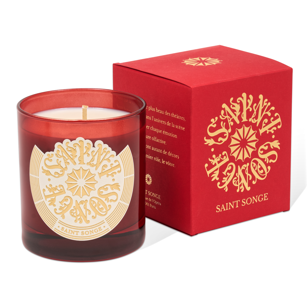 Bougie parfumée Saint Songe de 180 grammes dans son pot en verre rouge et son étiquette ivoire et or