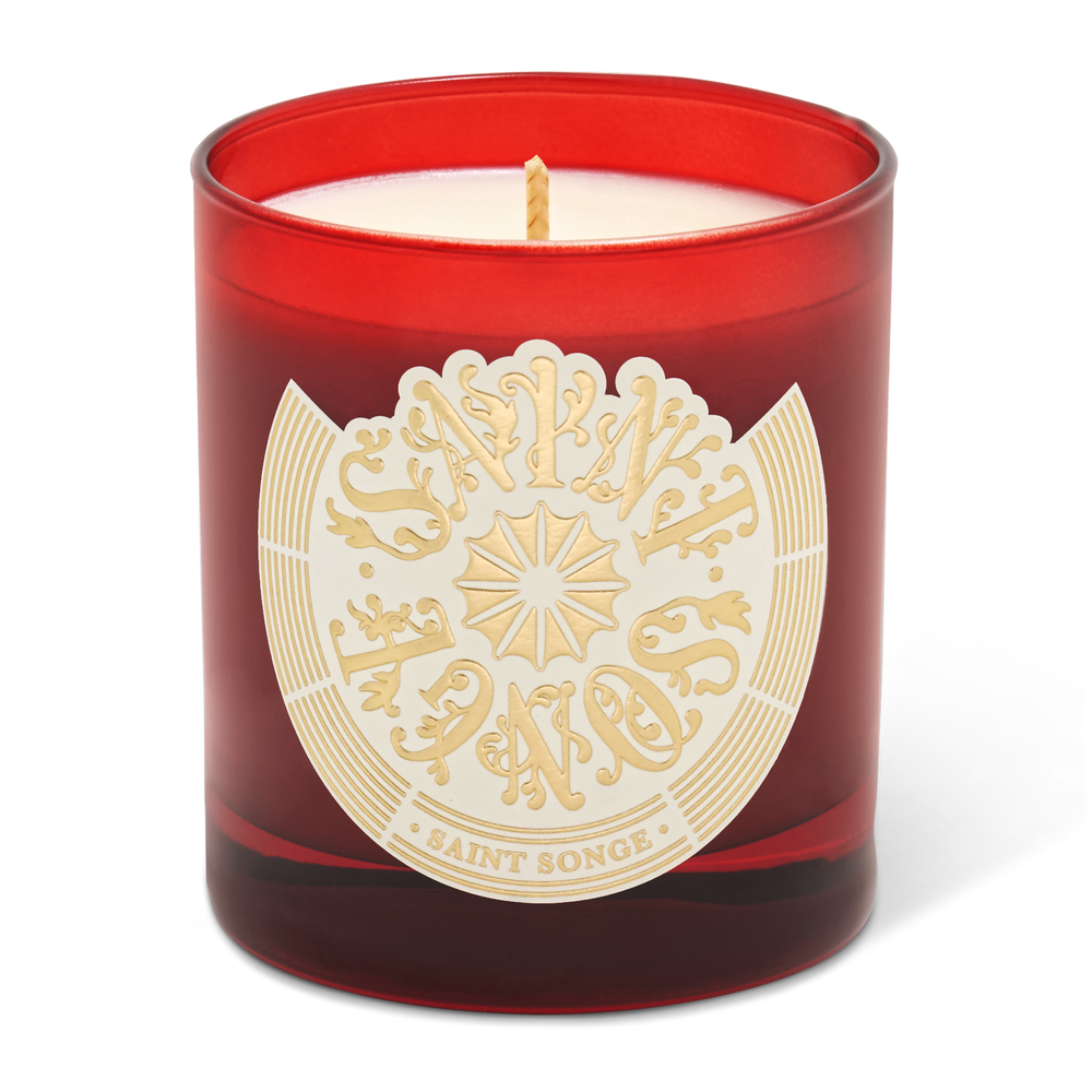 Bougie parfumée Saint Songe de 180 grammes dans son pot en verre rouge et son étiquette ivoire et or
