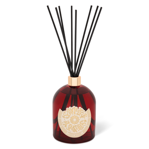 Bouquets parfumés Saint Songe de 500 millilitres dans son flacon en verre rouges et or, avec son étiquette ivoire et or et ses bâtonnets noirs.