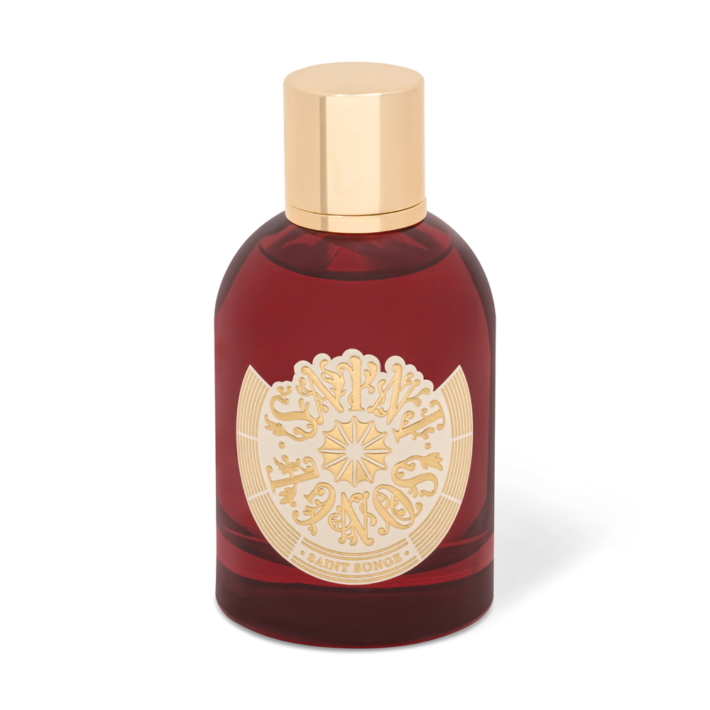 Brumes parfumée Saint Songe de 100 millilitres dans son flacon en verre rouge et or, avec son étiquette ivoire et or.